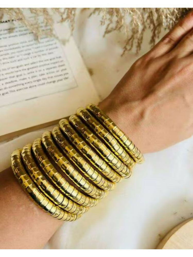 NVR Women Handmade Gold-Polished Spiral Bangle | Grocsy
