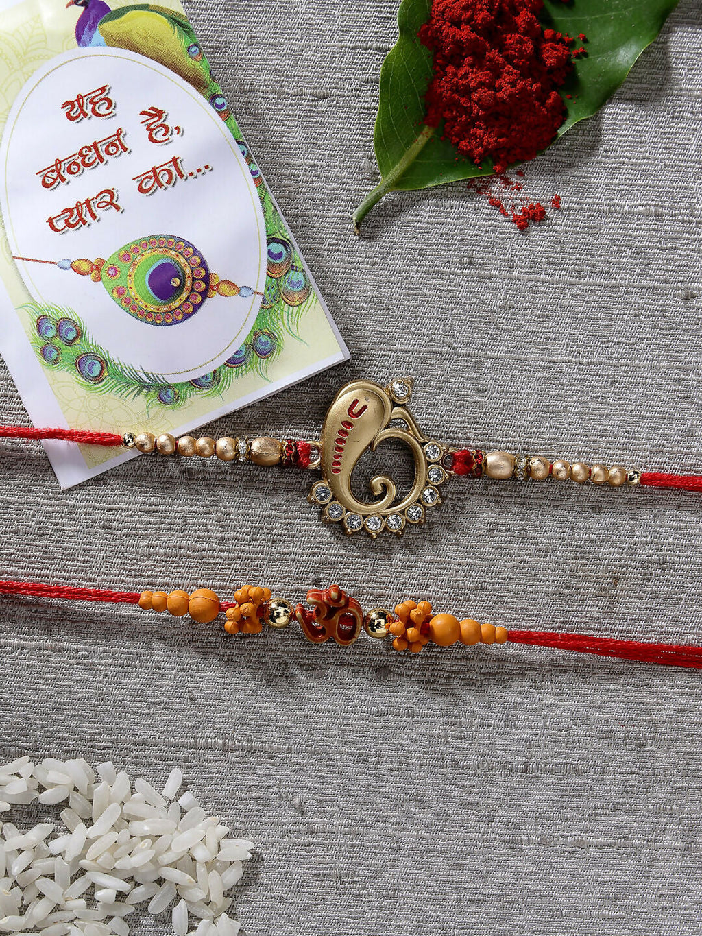 NVR Men Set of 2 Gold-Toned Ganesha Stone-Studded Rakhi With Roli Chawal | Grocsy