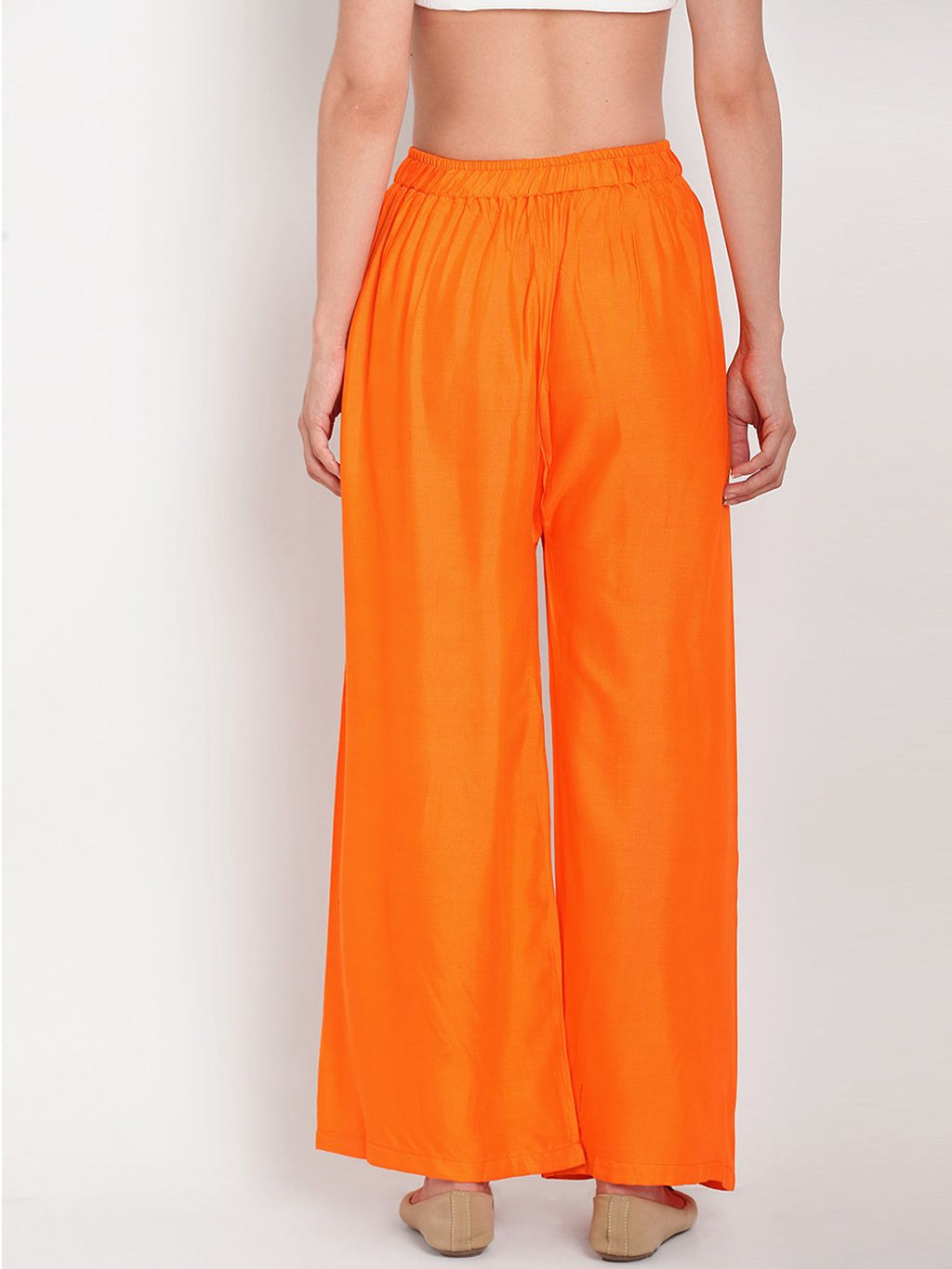 TAG 7 Women Orange Solid Flared Palazzos | Grocsy