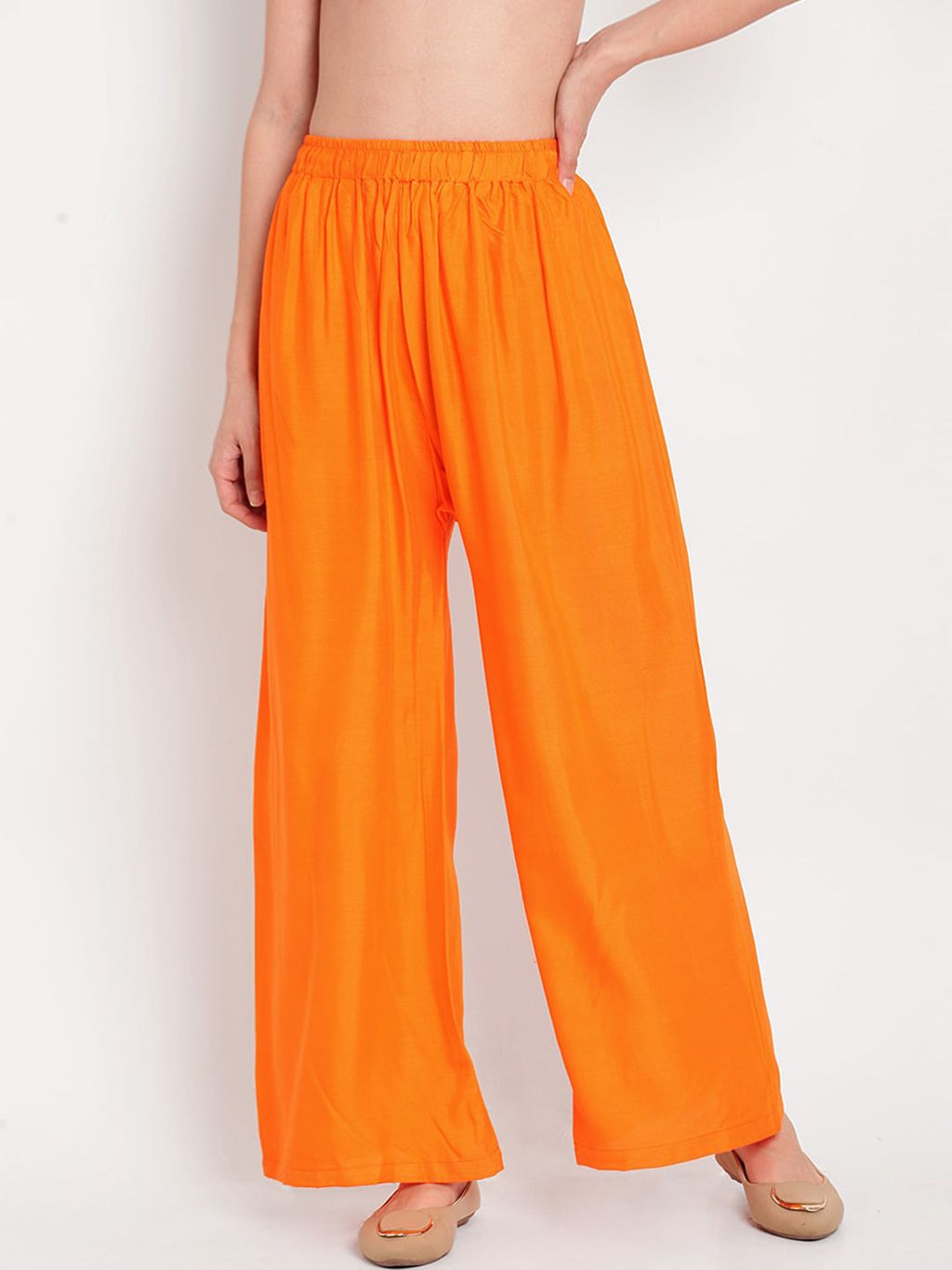 TAG 7 Women Orange Solid Flared Palazzos | Grocsy