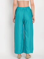 TAG 7 Women Turquoise Blue Solid Flared Palazzos | Grocsy
