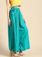 TAG 7 Women Turquoise Blue Solid Flared Palazzos | Grocsy