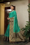 Vardha Teal Green Golden Zari Banarasi Raw Silk Saree | Grocsy