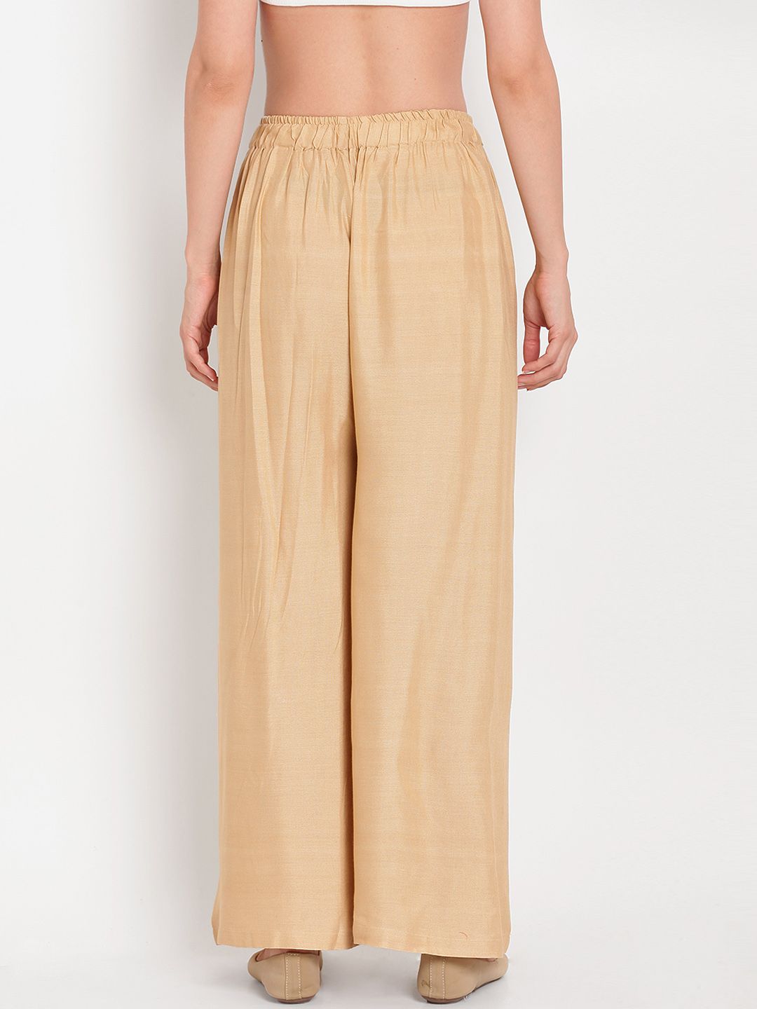 TAG 7 Women Beige Solid Flared Palazzos | Grocsy