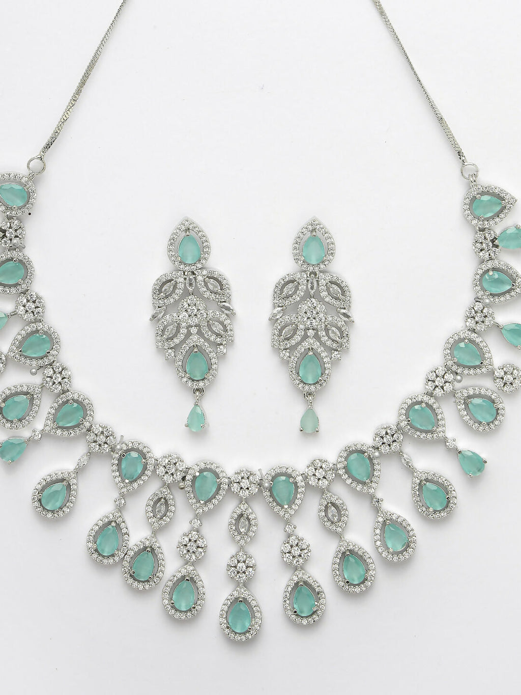 NVR Women's silver plated Turquoise CZ stone handcrafted jewellery set | Grocsy