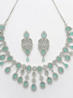 NVR Women's silver plated Turquoise CZ stone handcrafted jewellery set | Grocsy