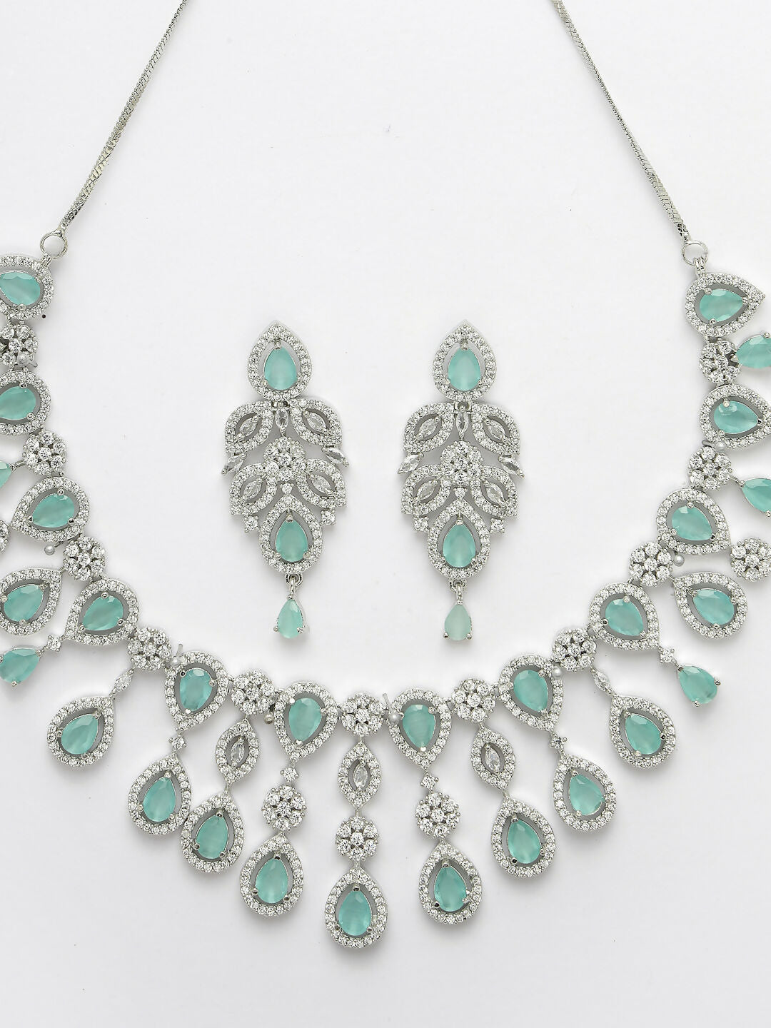 NVR Women's silver plated Turquoise CZ stone handcrafted jewellery set | Grocsy
