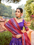 Vastranavya Patola Printed and Foil Work Tussar Silk Lehenga with Unstitched Blouse - Purple | Grocsy