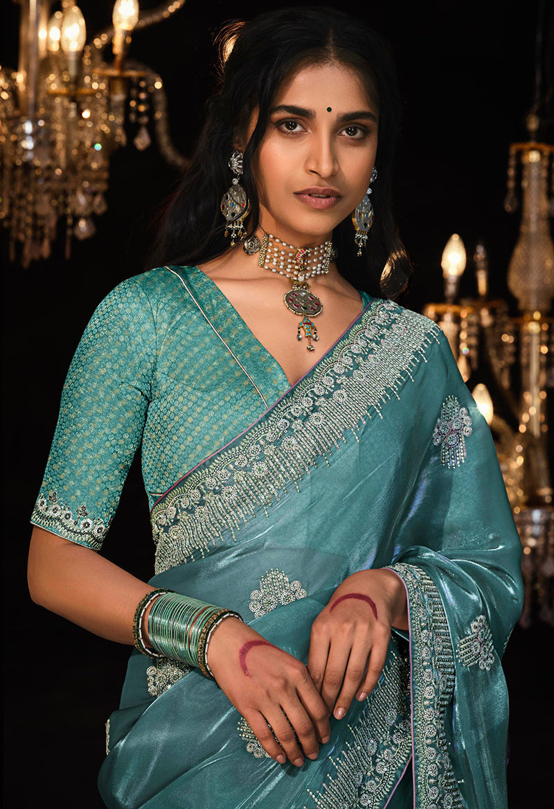 Monjolika Fashion Teal Blue Colour Tissue Silk Embroidered Saree | Grocsy