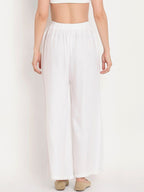 TAG 7 Women White Solid Flared Palazzos | Grocsy