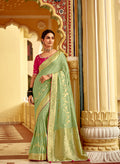Monjolika Fashion Mint Green Dola Silk Wedding Saree with Golden Zari Weaving | Grocsy