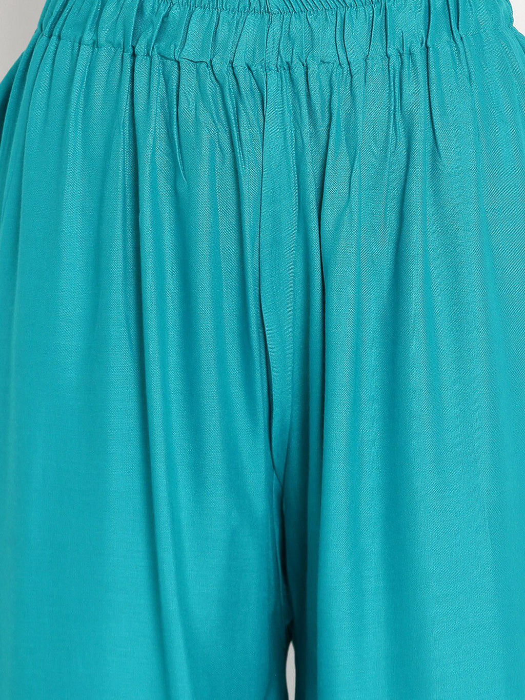 TAG 7 Women Turquoise Blue Solid Flared Palazzos | Grocsy
