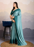 Monjolika Fashion Teal Blue Color Satin Crepe Pearl Lace Border Party Wear Saree | Grocsy