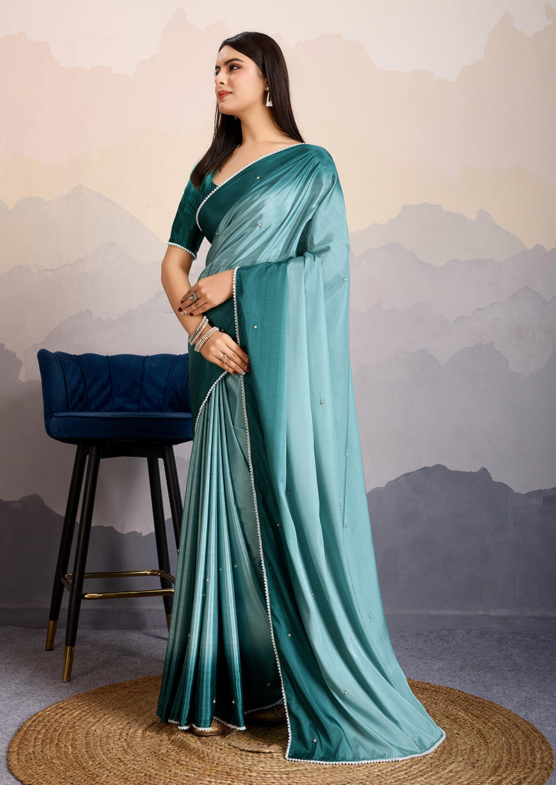 Monjolika Fashion Teal Blue Color Satin Crepe Pearl Lace Border Party Wear Saree | Grocsy