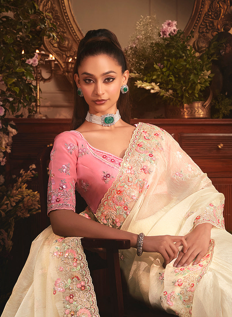 Monjolika Fashion Designer Cream Tissue Organza Saree With All Over Butta Work & Heavy Stone Embellished Border | Grocsy