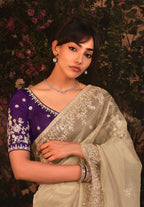 Monjolika Fashion Designer Beige Tissue Organza Saree With All Over Butta Work & Heavy Stone Embellished Border | Grocsy