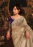 Monjolika Fashion Designer Beige Tissue Organza Saree With All Over Butta Work & Heavy Stone Embellished Border | Grocsy