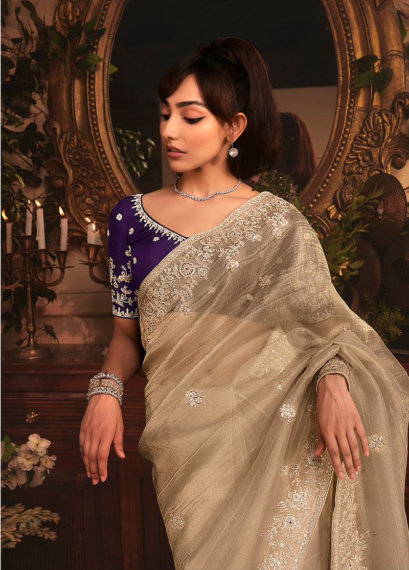 Monjolika Fashion Designer Beige Tissue Organza Saree With All Over Butta Work & Heavy Stone Embellished Border | Grocsy