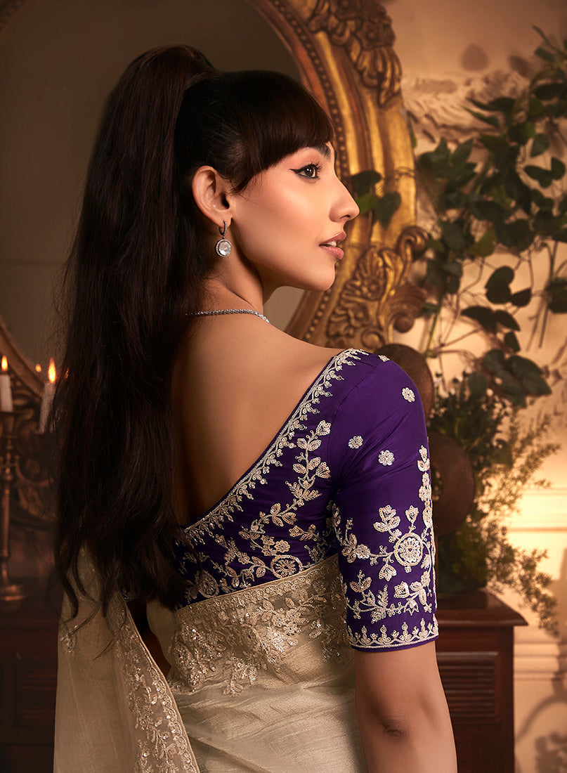 Monjolika Fashion Designer Beige Tissue Organza Saree With All Over Butta Work & Heavy Stone Embellished Border | Grocsy
