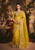 Monjolika Fashion Designer Mustard Tissue Organza Saree With All Over Butta Work & Heavy Stone Embellished Border | Grocsy