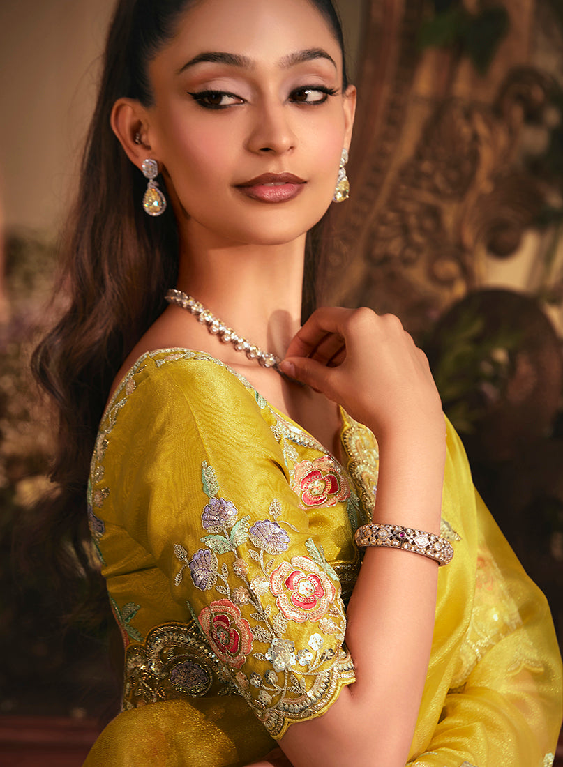 Monjolika Fashion Designer Mustard Tissue Organza Saree With All Over Butta Work & Heavy Stone Embellished Border | Grocsy