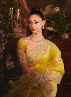 Monjolika Fashion Designer Mustard Tissue Organza Saree With All Over Butta Work & Heavy Stone Embellished Border | Grocsy