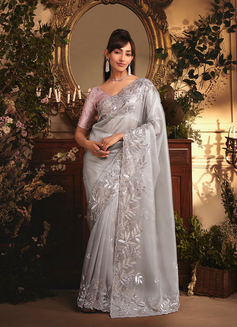 Monjolika Fashion Designer Light Grey Tissue Organza Saree With All Over Butta Work & Heavy Stone Embellished Border | Grocsy