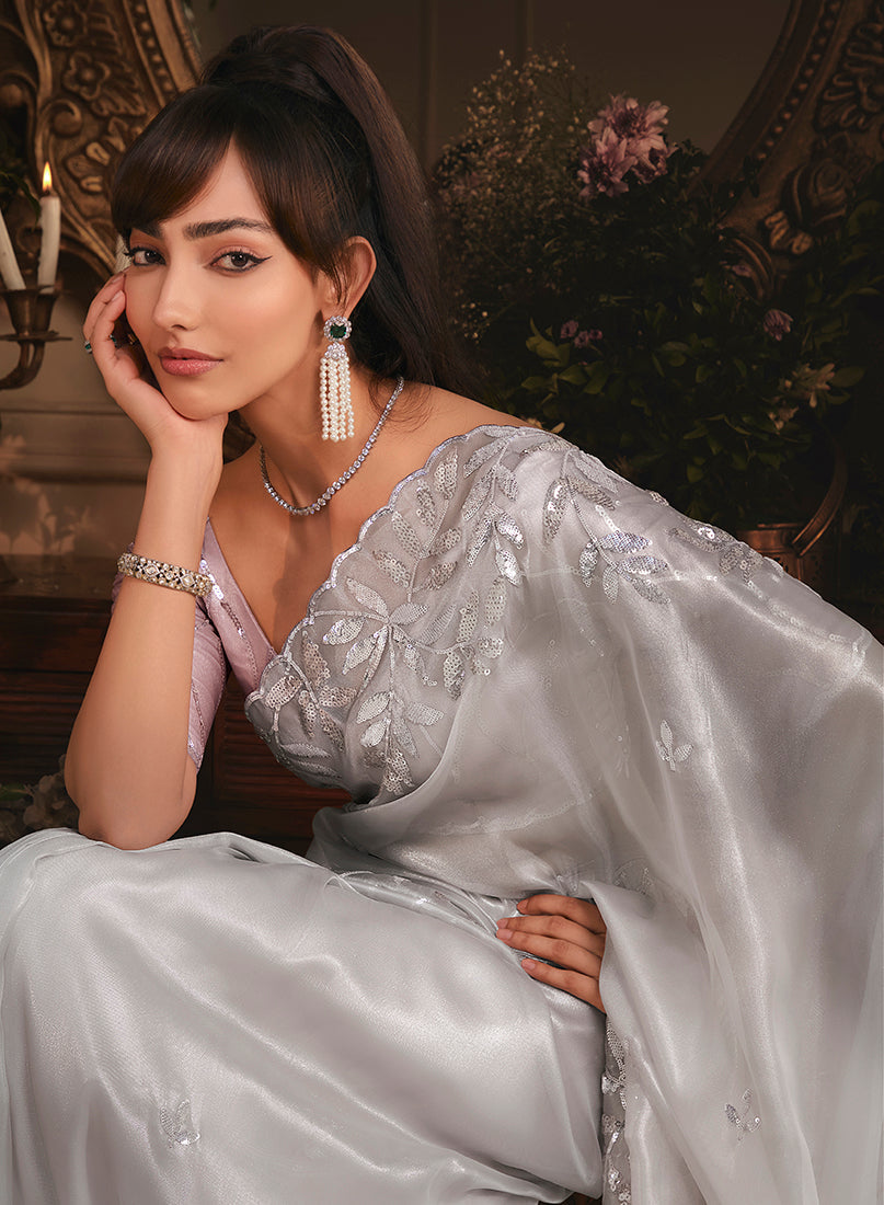 Monjolika Fashion Designer Light Grey Tissue Organza Saree With All Over Butta Work & Heavy Stone Embellished Border | Grocsy