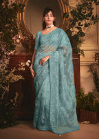 Monjolika Fashion Designer Aqua Blue Tissue Organza Saree With All Over Butta Work & Heavy Stone Embellished Border | Grocsy