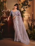 Monjolika Fashion Designer Light Lilac Tissue Organza Saree With All Over Butta Work & Heavy Stone Embellished Border | Grocsy