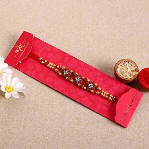 Ethnic American Diamond Rakhi and Kaju Katli Box Combo | Grocsy