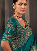 Monjolika Fashion Teal Faux Satin Embroidery Bridal Reception Festival Wedding Wear Heavy Border Saree | Grocsy