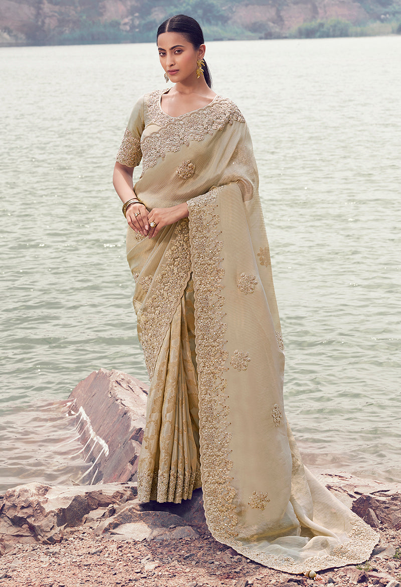 Monjolika Fashion Beige Embroidered Woven Faux Tissue Silk Saree | Grocsy