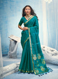 Monjolika Fashion Teal Blue Linen Silk Blend Saree with Gold Zari Border & Floral Woven Pallu | Grocsy