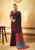 Monjolika Fashion Black Satin Printed Saree With Orange Border And Unstiched Blouse | Grocsy