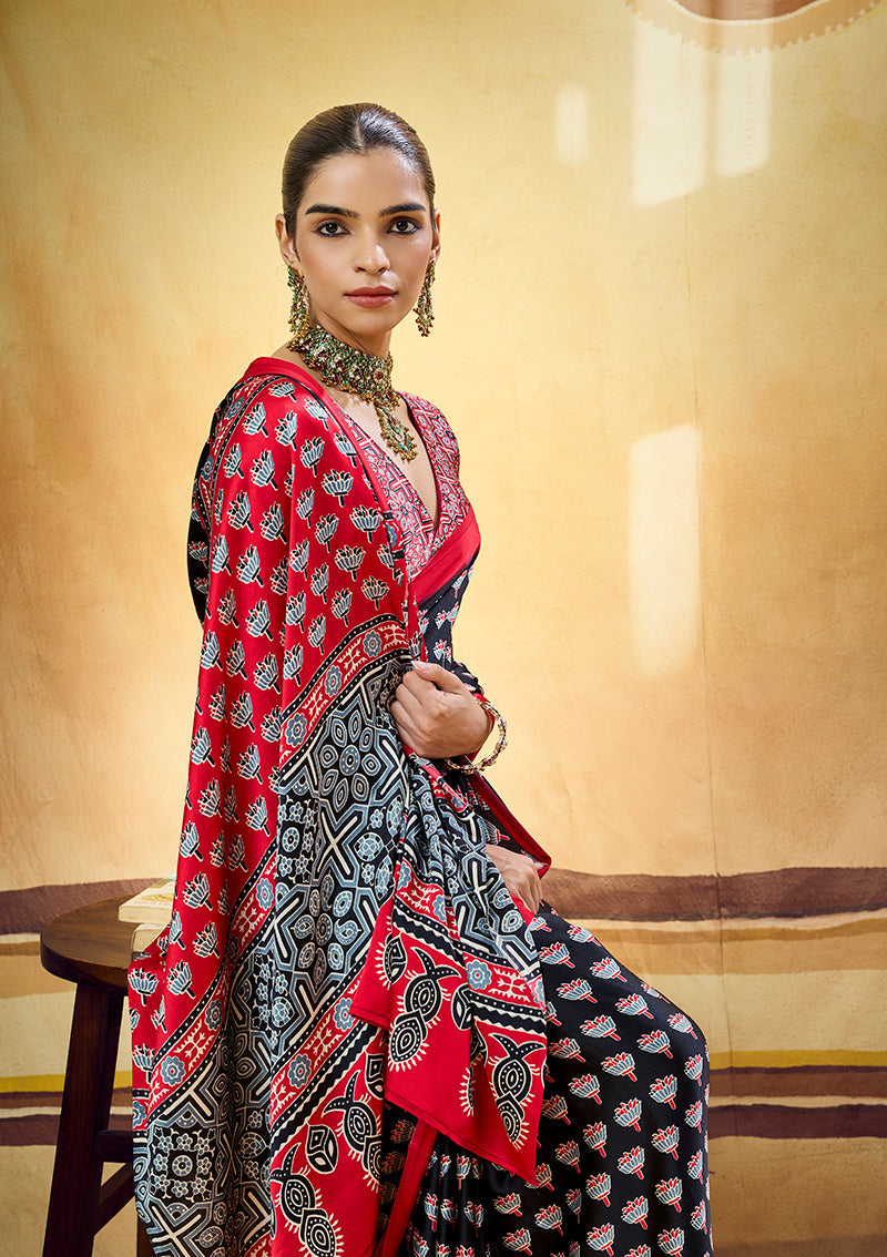 Monjolika Fashion Black Satin Printed Saree With Orange Border And Unstiched Blouse | Grocsy
