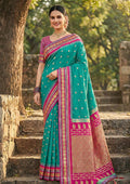 Monjolika Fashion Sea Green Banarasi Silk Blend Saree with Magenta Pink Zari Border | Grocsy