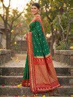 Monjolika Fashion Dark Green Banarasi Silk Blend Saree with Red Zari Border | Grocsy
