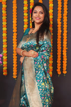Monjolika Fashion Teal Blue Banarasi Silk Blend Saree With Floral Jaal & Zari Border | Grocsy