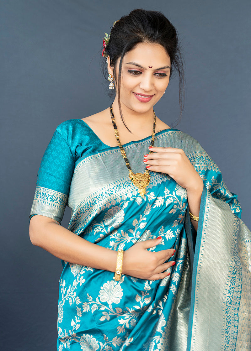 Monjolika Fashion Aqua Blue Banarasi Silk Blend Saree With Floral Zari Weaving | Grocsy