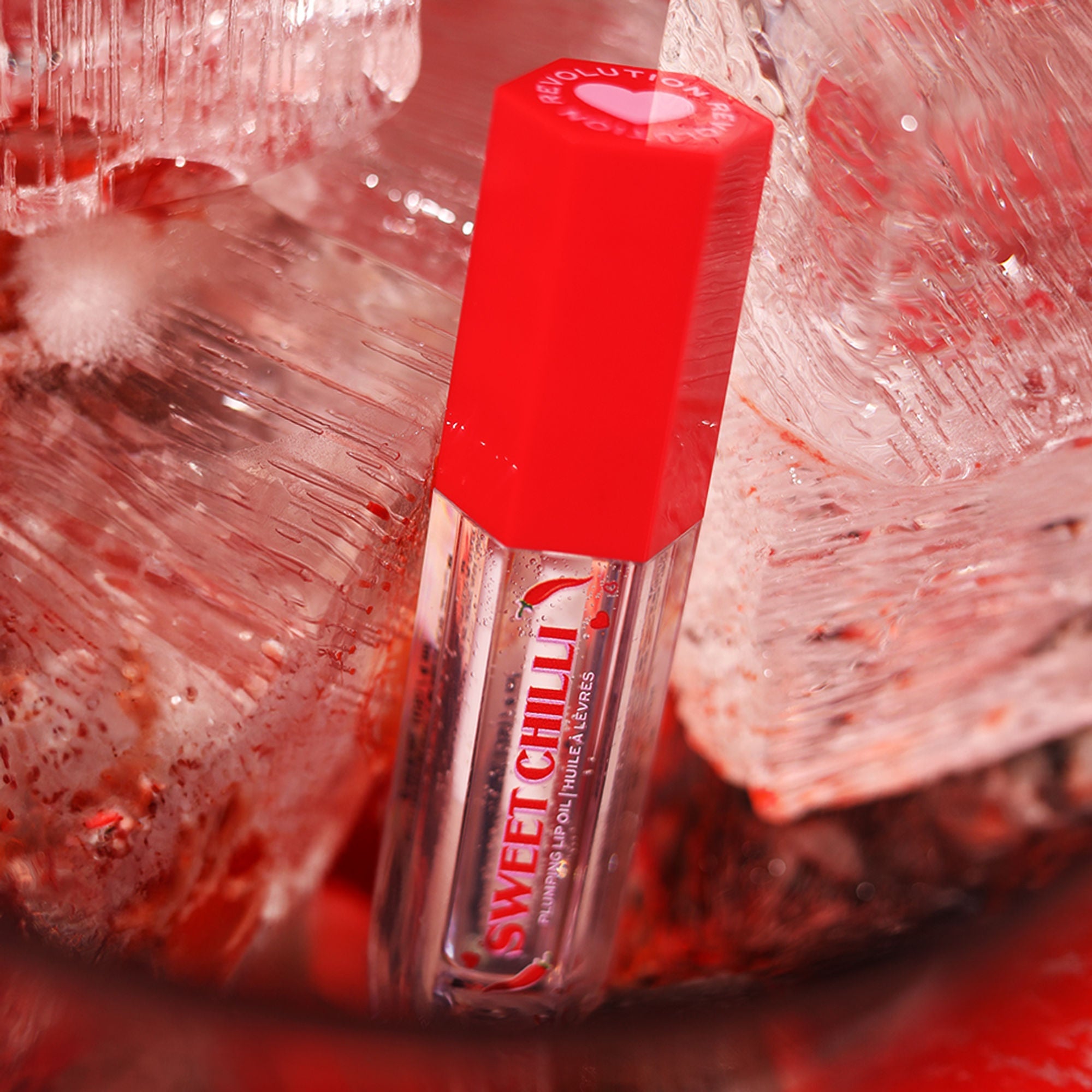 Makeup Revolution Heart Revolution Sweet Chilli Plumping Lip Oil - Clear | Grocsy