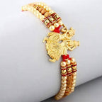 Krishna Designer Rakhi and Soan Papdi | Grocsy