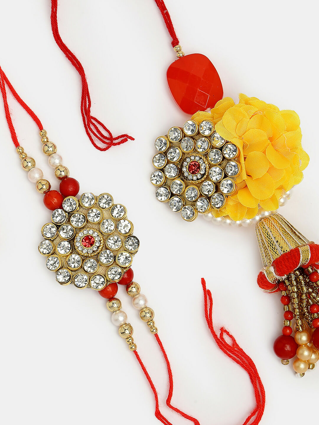 NVR Women & Men Set of 2 Red & Gold-Toned Stone-Studded & Beaded Bhaiya Bhabhi Rakhi With Roli Chawal & Chocolate | Grocsy