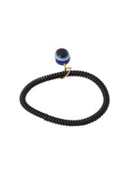 NVR Women & Men Black Evil Eye Spring Ring Rakhi With Roli Chawal | Grocsy