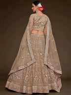 Tulsi Art Gorgeous Beige Embroidered Soft Net Occasion Wear Lehenga Choli | Grocsy