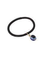 NVR Women & Men Black Evil Eye Spring Ring Rakhi With Roli Chawal | Grocsy