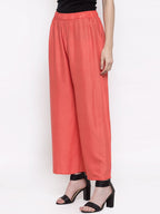 TAG 7 Women Peach-Coloured Solid Flared Palazzos | Grocsy
