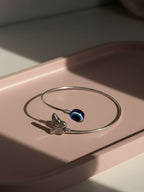 NVR Women Rhodium Plated Evil Eye Kada Bracelet | Grocsy