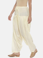 Souchii Cream-Coloured Solid Loose-Fit Patiala | Grocsy