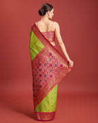 Monjolika Fashion Exquisite Designs With This Regal Parrot Green Patola Pallu Banarasi Tissue Silk Saree | Grocsy